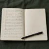 Split image showing a journal on a bright morning desk on the left and the same journal under warm lamp light at night on the right