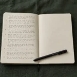 Split image showing a journal on a bright morning desk on the left and the same journal under warm lamp light at night on the right